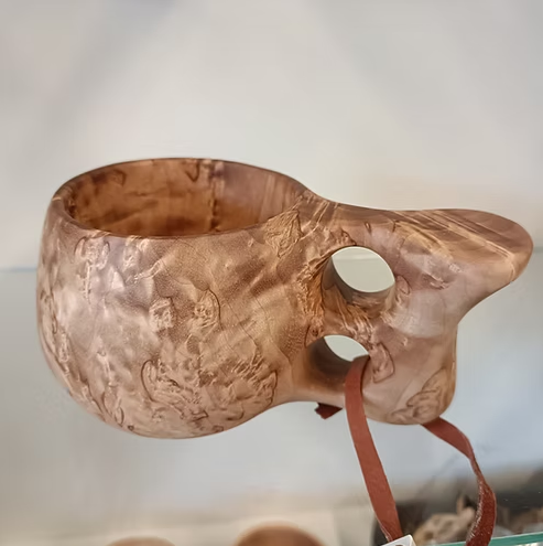 Kuksi with two fingered handle