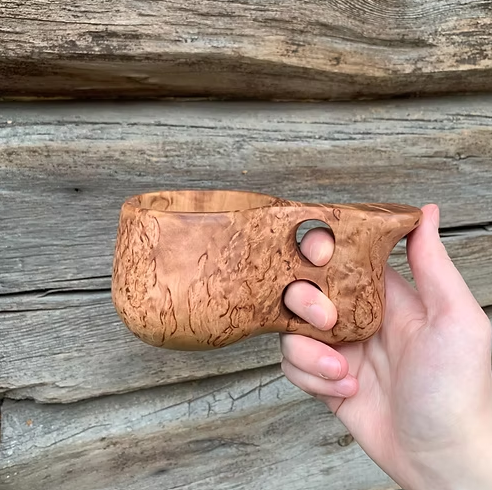 Kuksi with two fingered handle