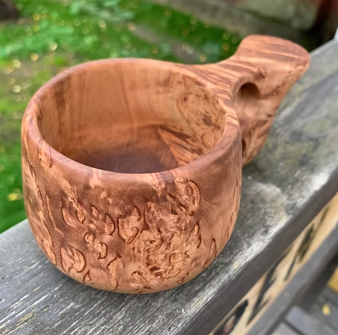Kuksi with two fingered handle