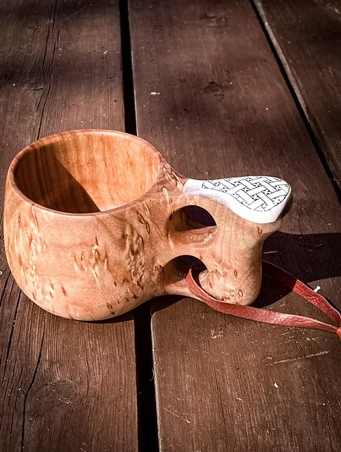 Kuksa cup with two fingered hand- engraved design handle